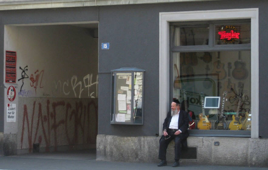 chassidic man in zurich switzerland with graffitis