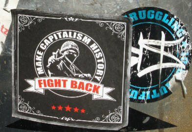 Make Capitalism History. Fight Back. Sticker in Zurich Switzerland. Plus BYS graffiti crew 10th anniversary sticker.