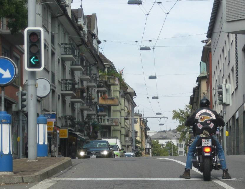member of hells angels switzerland mc on his motorbike on langstrasse zurich switzerland