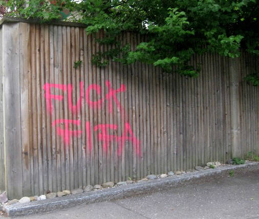 FUCK FIFA red graffiti tag in zurich switzerland after color bomb attack on FIFA world headquarters on june 14 2014